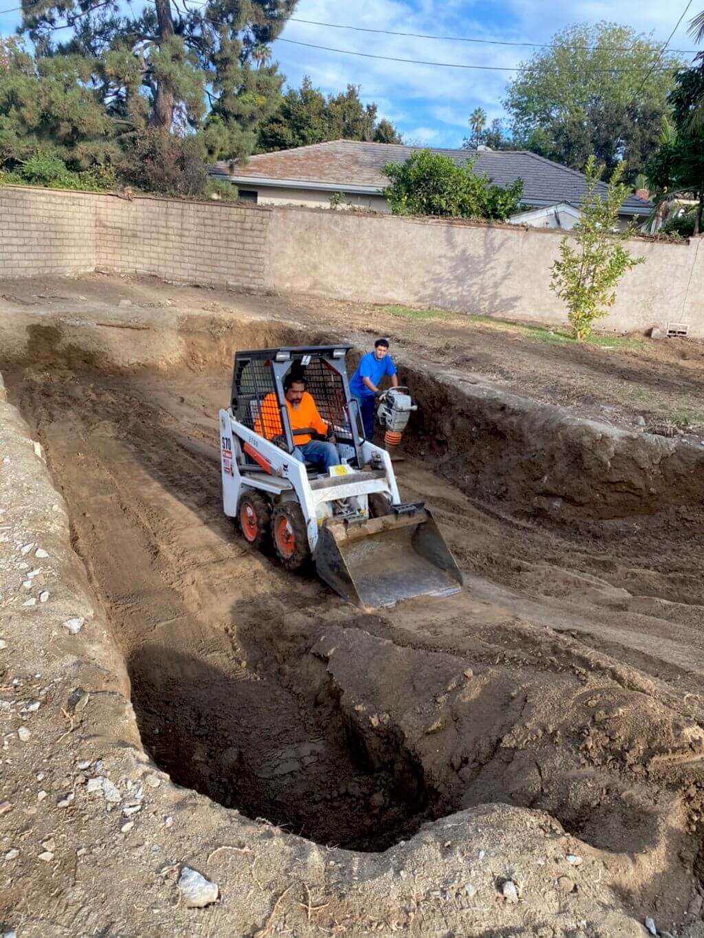 Worker using demolition vehicle