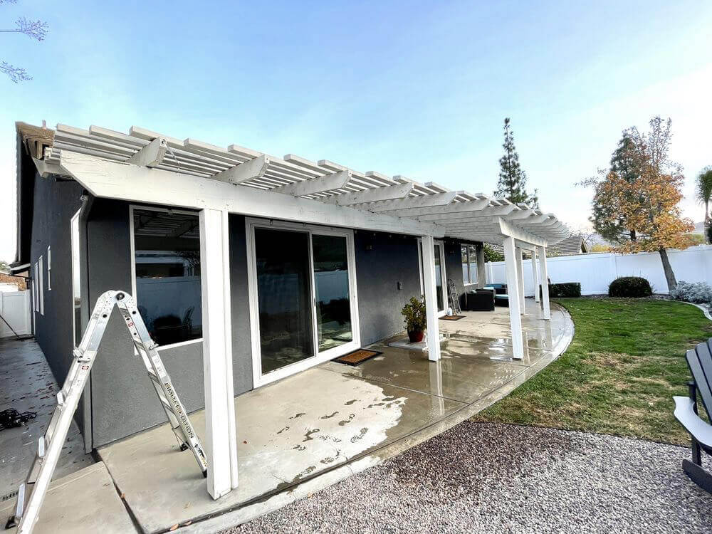 Backyard of a home with a patio cover